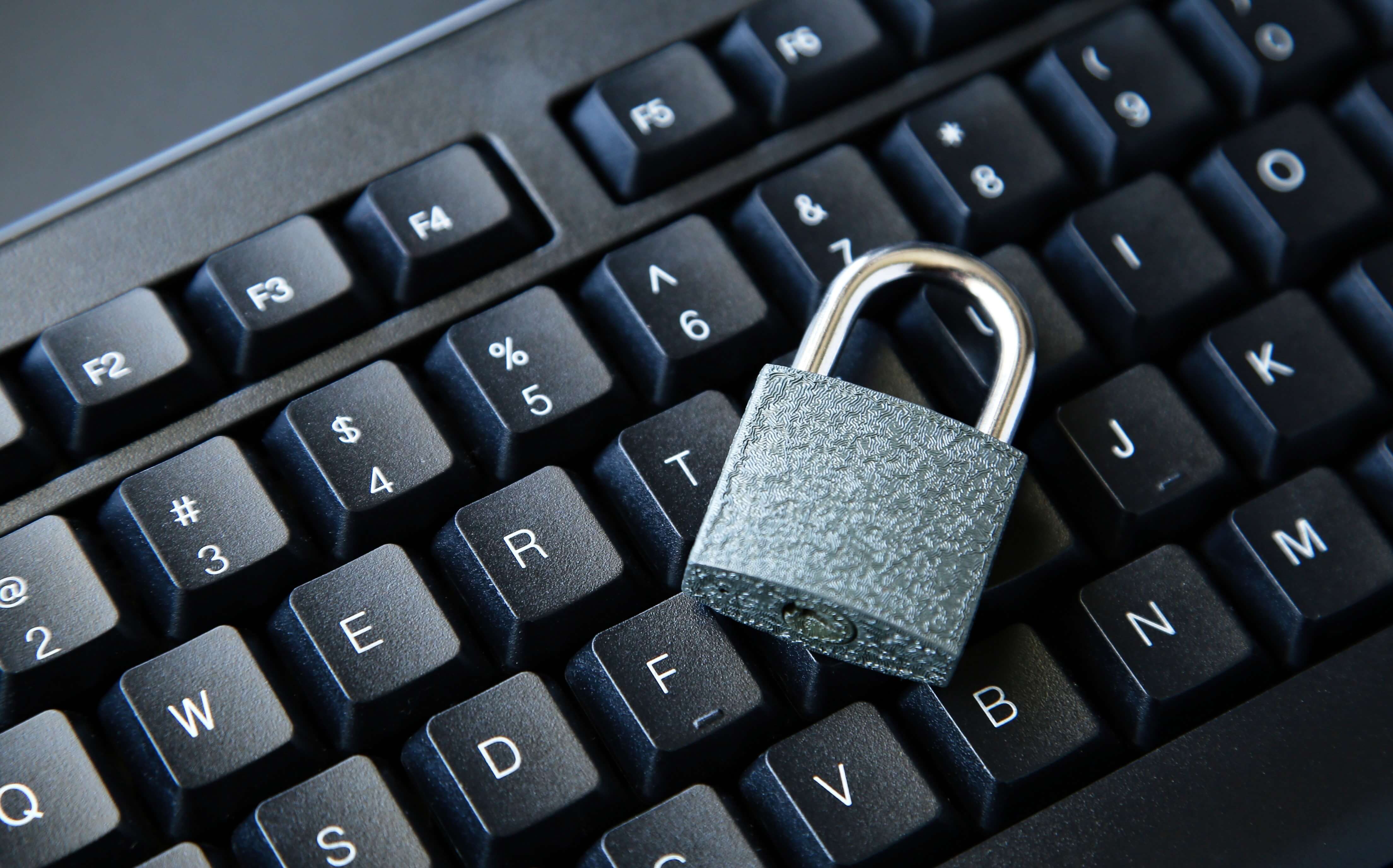 Padlock on a black keyboard